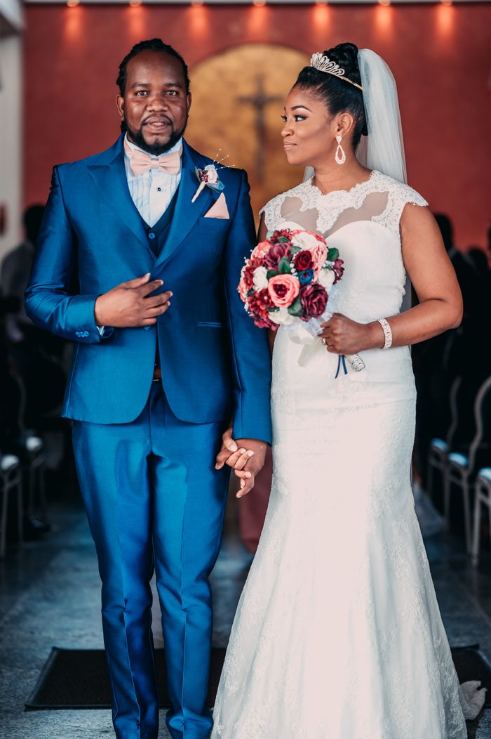 Beautiful couple in wedding attire at a ceremony in Port of Spain, Trinidad and Tobago.